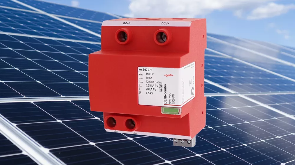 Red DEHN surge protector shown in front of solar panels under a blue sky.